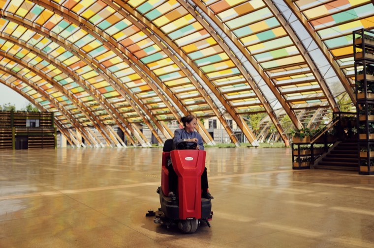 Commercial floor cleaned with a ride-on auto-scrubber