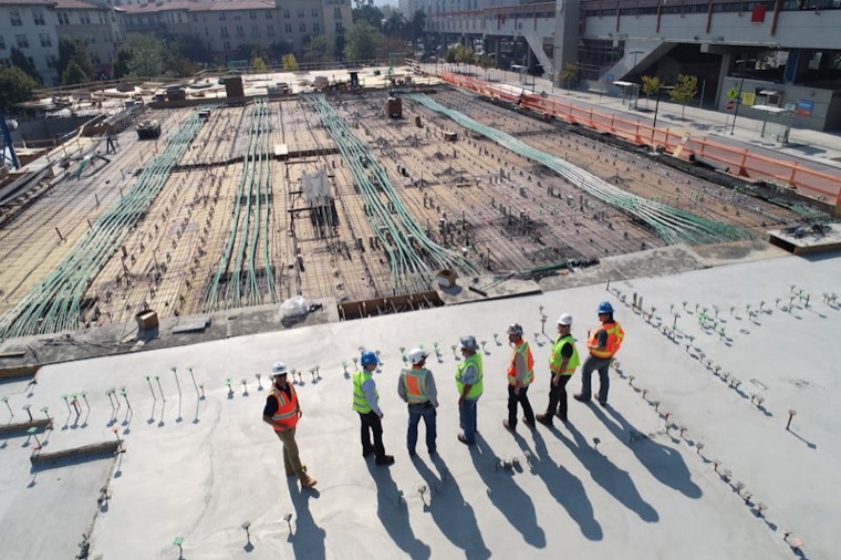 Post-construction site being cleaned by crew